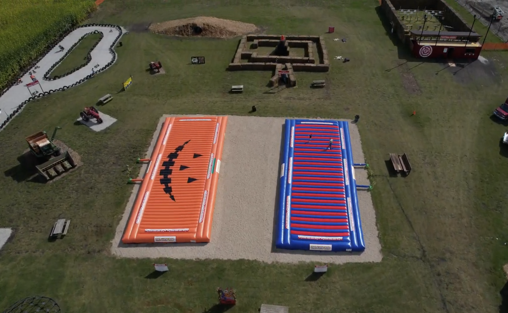 Aerial view of farm activities including jump pads and go-karts